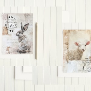 May include: Two framed prints with religious themes. The first print features a white rabbit with brown markings and the text "I know that my Redeemer LIVES." The second print features a white lamb with the text "By His Wounds We Are Healed."