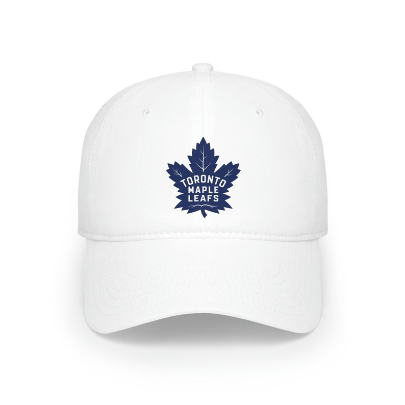 May include: White baseball cap with a blue Toronto Maple Leafs logo featuring a maple leaf and the team name.