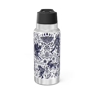 May include: A stainless steel water bottle with a black lid and a white and blue design featuring a variety of mythical creatures and floral patterns.