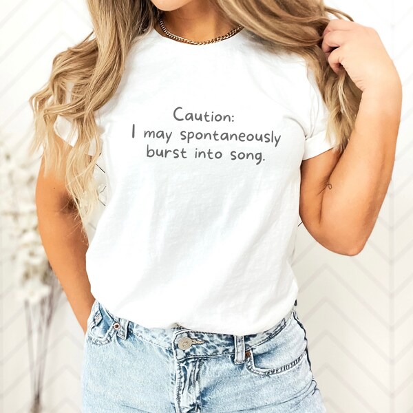 Caution I May Spontaneously Break Into Song T-Shirt - Your Melodious Companion! Perfect for Singing Enthusiasts, Music Teachers, and Choirs.