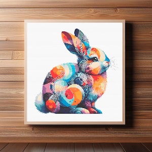 May include: A colorful abstract rabbit with a white background. The rabbit is made up of circles, swirls, and geometric shapes in shades of blue, orange, red, and purple.