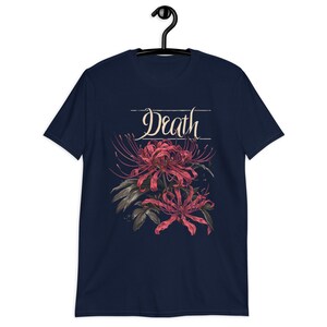 May include: Navy blue t-shirt with a red flower graphic and the word "Death" in white script.