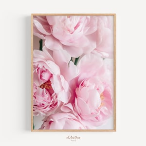 May include: A close-up of a bouquet of soft pink peonies. The flowers are in full bloom and have a delicate, feminine feel.