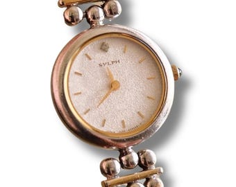 Reloj Citizen Sylph de cuarzo bicolor para mujer, estilo vintage de los años 90.