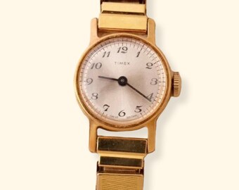 Vintage Timex Mechanical Ladies Gold Watch on a Stretch Watch Band Working