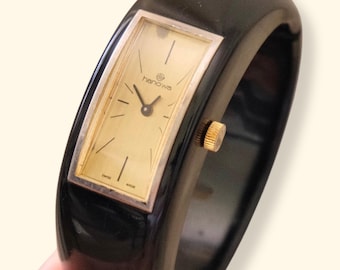 Rare 1970s Hanowa Mage Swiss-made ladies bangle watch featuring a rectangular gold-tone dial Manual Wind