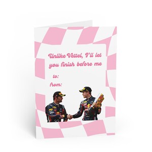 May include: A greeting card with a pink and white checkered background. The card features a photo of two race car drivers shaking hands. The text on the card reads "Unlike Vettel, I'll let you finish before me." There are blank lines for "to:" and "from:".