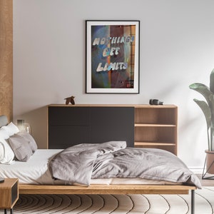 May include: A framed print with a blue, green, and red background featuring the text "NOTHING OFF LIMITS" in white lettering.