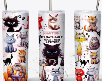May include: Three white stainless steel tumblers with various grumpy cat illustrations. One tumbler features the text "CAUTION MY CATS CAN'T HOLD THEIR ATTITUDE". The cats are in various colors, including black, orange, gray, and red.