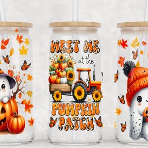 May include: Three clear glass tumblers with lids and straws. Each tumbler features a different fall-themed design with a ghost, a tractor, and a pumpkin patch. The tumblers are perfect for fall drinks.