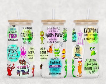 May include: Three clear glass tumblers with lids and straws. Each tumbler features a different design with colorful cartoon monsters and humorous sayings. The sayings include "I'm holding a cup of coffee so yeah I'm pretty busy", "Some people just need a high five in the face with a chair", and "Everyone was thinking it I just said it".