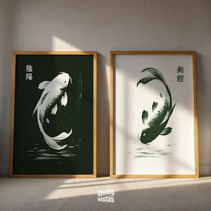 May include: Two framed art prints featuring koi fish illustrations. One print has a white koi on a dark green background, the other has a green koi on a white background. Both prints are in wooden frames.