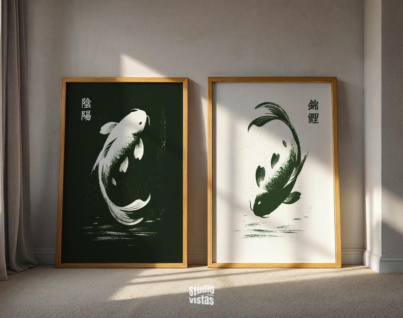 May include: Two framed art prints featuring koi fish illustrations. One print has a white koi on a dark green background, the other has a green koi on a white background. Both prints are in wooden frames.
