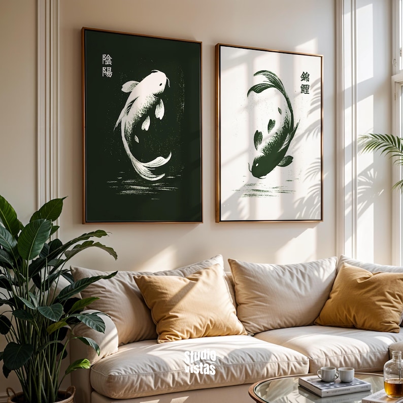 May include: Two framed art prints featuring koi fish. One print has a white koi on a dark green background with Japanese characters. The other print has a dark green koi on a white background with Japanese characters. Both are in wooden frames.