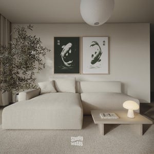 May include: A modern living room with a beige sectional sofa, a light wood coffee table, and two framed koi fish prints. A white mushroom-shaped lamp sits on the table. The room has a neutral color palette with a large rug and a decorative plant.