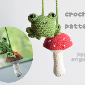 May include: Crocheted frog and mushroom ornaments. The frog is green and sits atop a red mushroom with white spots. The text "crochet pattern" and "PDF english" are also visible.
