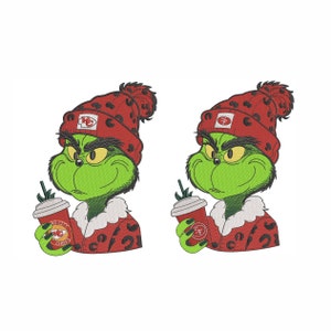 May include: Two green Grinch characters wearing red and black Santa hats with a white fur trim. Each Grinch is holding a red cup with a white lid and the text "KC City Chiefs" on the side.