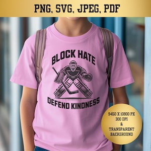 May include: Pink t-shirt with a black and white graphic of a hockey goalie with the text "Block Hate Defend Kindness".