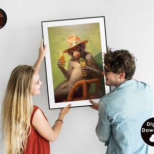 May include: A framed painting of a monkey wearing a straw hat and holding two glasses of juice. The monkey is sitting in a wicker chair against a green background.
