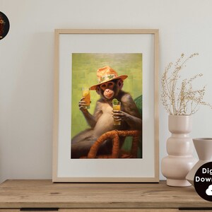 May include: A framed illustration of a monkey wearing a straw hat and holding two glasses of orange juice. The monkey is sitting in a wicker chair with a green background.