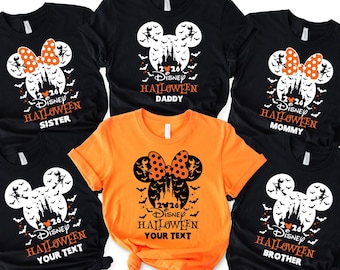 May include: A collection of five short-sleeved t-shirts in black and orange. Each shirt features a graphic of a Mickey Mouse silhouette containing a castle, bats, and a witch. Text includes 2026, Disney Halloween, and labels like Sister, Daddy, Mommy, Brother, or Your Text.