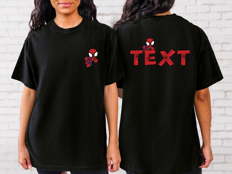 May include: Two black t-shirts featuring a red and blue Spiderman graphic. One shirt has the graphic on the front and the other has the graphic on the back with the text "TEXT".