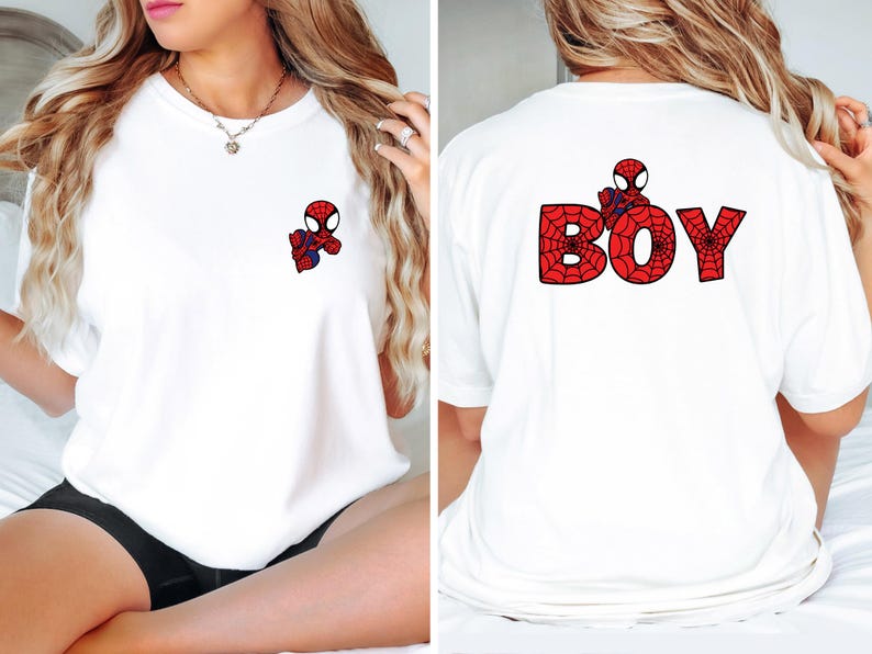 May include: White t-shirt with a small Spiderman graphic on the front pocket and the word "BOY" with a Spiderman design on the back.