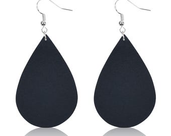 May include: A pair of black teardrop-shaped earrings with silver hooks.