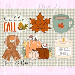 May include: A collection of six autumn-themed stickers featuring the text hello FALL, a maple leaf, a green mug with a leaf, a brown plaid scarf, three pumpkins with berries, and a candle labeled FRESH BAKED COOKIES on a checkered background.