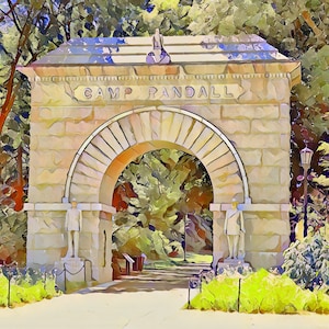 May include: A stone archway with the words "Camp Randall" inscribed above. The archway is surrounded by lush green trees and foliage.
