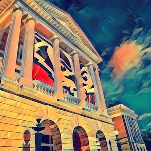 May include: A yellow building with columns and a large banner featuring a black and red abstract design. The building has a series of arches and is set against a blue and green sky.