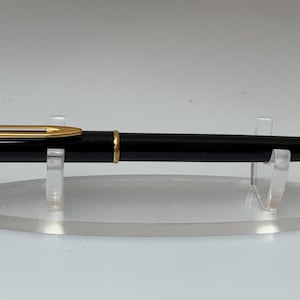 Bolígrafo Waterman negro con detalles dorados, mecanismo de pulsar, vintage