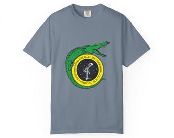 Camiseta con el logo del caimán de la Sociedad Astronómica de los Everglades