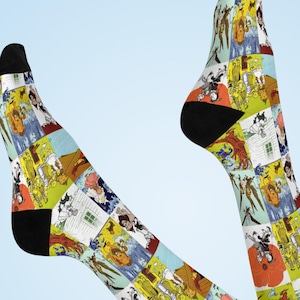 Trollkarlen från Oz-strumpor, vadderade strumpor med den elliga häxan, Dorothy, plåtmannen, fågelskrämman och lejonet som bokkonst för Oz-fans och bokälskare.