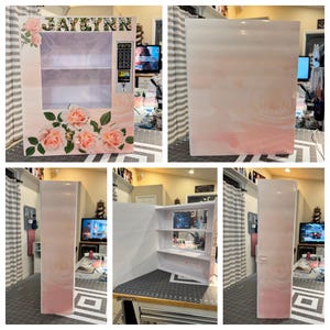 May include: A decorative vending machine with a floral design. The front features a clear window, shelves, and a keypad. The exterior is adorned with pink roses and the name "JAYLYNN". The sides and top have a soft pink and white gradient.