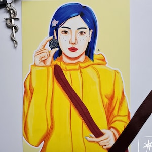 May include: A hand-drawn illustration of a girl with blue hair wearing a yellow raincoat and holding a button. The girl has freckles and is looking at the button.