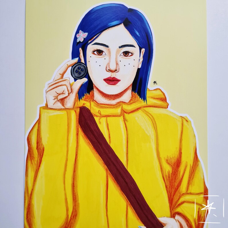 May include: A hand-drawn illustration of a girl with blue hair wearing a yellow raincoat and holding a black button. The girl has freckles and is looking at the button.