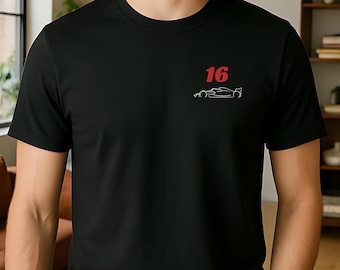 May include: Black t-shirt featuring the number "16" in red and a white outline of a racing car. The design is on the upper left chest. The shirt has short sleeves.