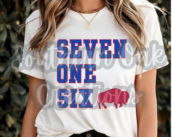 May include: White t-shirt with blue and red text that says "SEVEN ONE SIX" and a red buffalo silhouette.