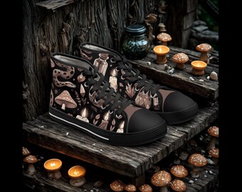 May include: Black high-top sneakers with a repeating pattern of mushrooms, candles, crystals, and snakes. The sneakers have black laces, a brown toe cap, and a white stripe along the sole. The shoes are displayed on a wooden surface.