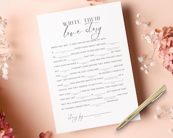 May include: A white paper game sheet titled Write Their Love Story with fill-in-the-blank lines for a mad libs style activity. The text is printed in black ink. A gold-toned metal pen rests diagonally across the bottom right corner.