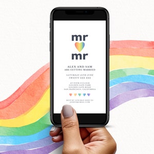 May include: A smartphone displays a wedding invitation with the words "mr" above "mr" and a rainbow heart. The invitation text reads "Alex and Sam are getting married" and includes the date and location. A watercolor rainbow is in the background.