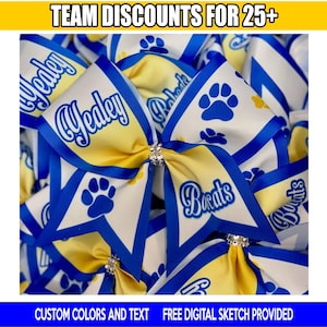 May include: A collection of yellow and white cheer bows with blue trim and blue paw print graphics. The bows feature the text "Yeley" and "Bobcats" in blue script. A rhinestone center accent is visible on each bow. Text reads "TEAM DISCOUNTS FOR 25+" and "CUSTOM COLORS AND TEXT FREE DIGITAL SKETCH PROVIDED".