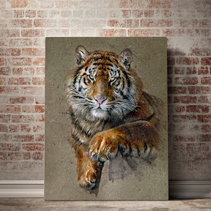 May include: A close-up of a tiger's face and paw. The tiger has orange and black stripes and green eyes. The background is a light brown watercolor wash.