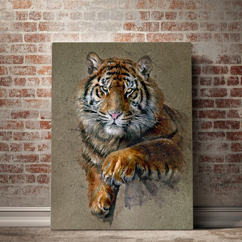 May include: A close-up of a tiger's face and paw. The tiger has orange and black stripes and green eyes. The background is a light brown watercolor wash.