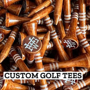 May include: A set of three ceramic mugs with a speckled, matte finish. The mugs are in shades of cream, light gray, and dark gray. Each mug has a simple, minimalist design and a rounded handle.