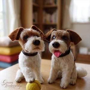May include: Two needle-felted Jack Russell Terrier dog figurines with brown and white fur, dark brown collars, and black noses. One figurine has its paw resting on a yellow felted tennis ball, while the other has its pink tongue sticking out.