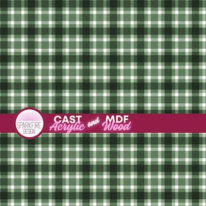 May include: A green, dark green, and white plaid pattern featuring a horizontal magenta banner across the lower section. The banner contains the circular Sparkfire Design logo and the white text CAST Acrylic and MDF Wood.