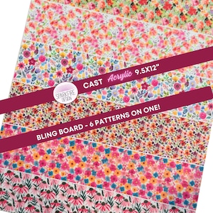 May include: A floral bling board with six different patterns. The board is 9.5 x 12 inches and features a variety of colorful flower designs in shades of pink, red, blue, and yellow. The text "CAST Acrylic" and "BLING BOARD - 6 PATTERNS ON ONE!" is visible.