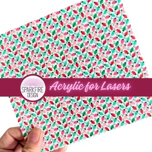 May include: A square sheet of acrylic featuring a repeating pattern of small red, green, and teal Christmas light bulbs connected by thin black lines. A circular logo with the text Sparkfire Design and the phrase Acrylic for Lasers is overlaid.
